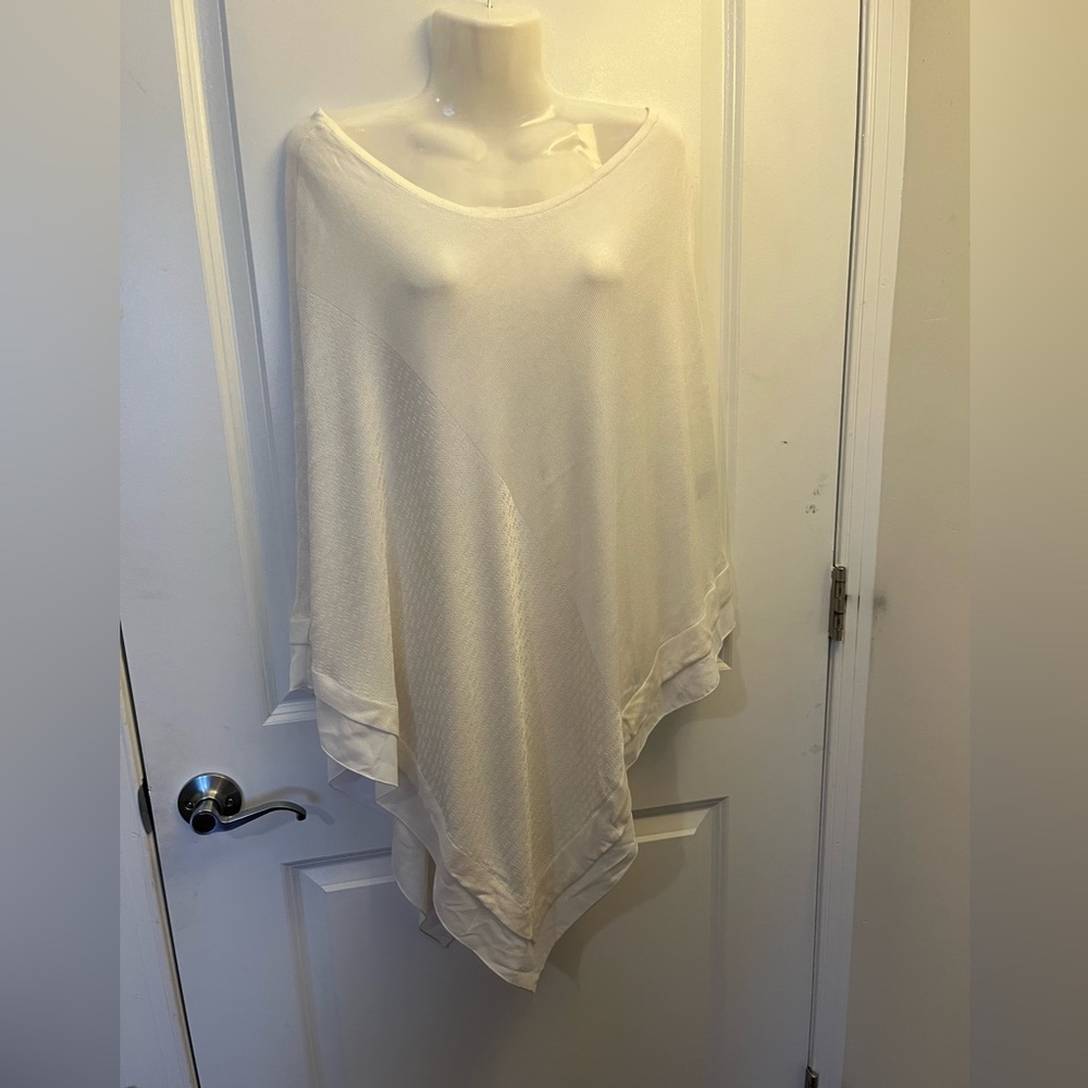 White knit poncho with sheer edge
